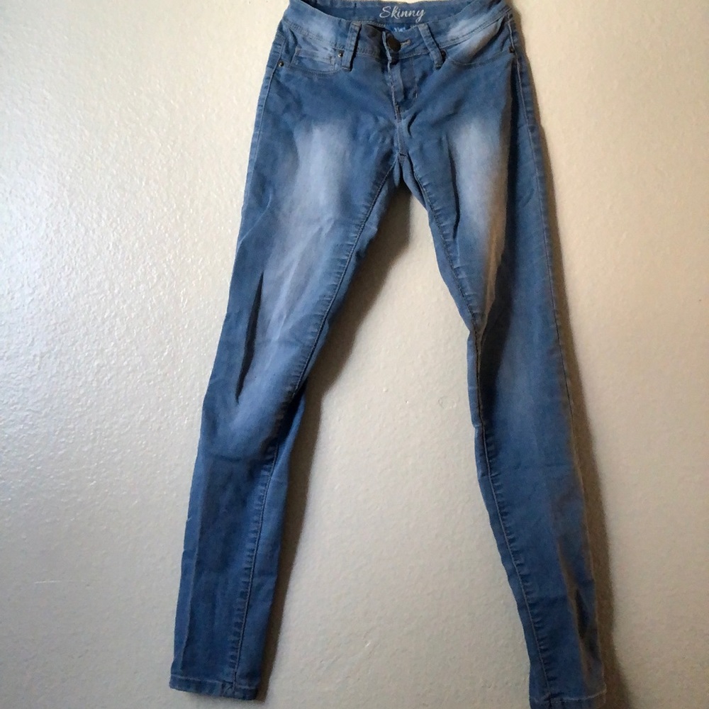 Blue wash skinny jeans.